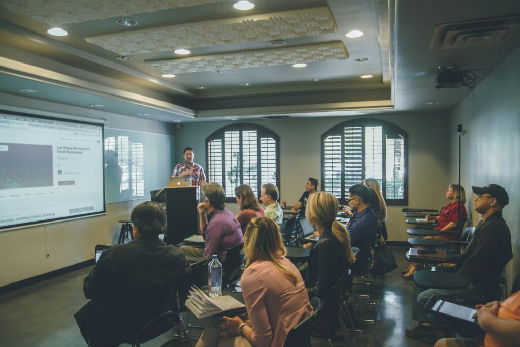 Adult students seated in a university seminar room