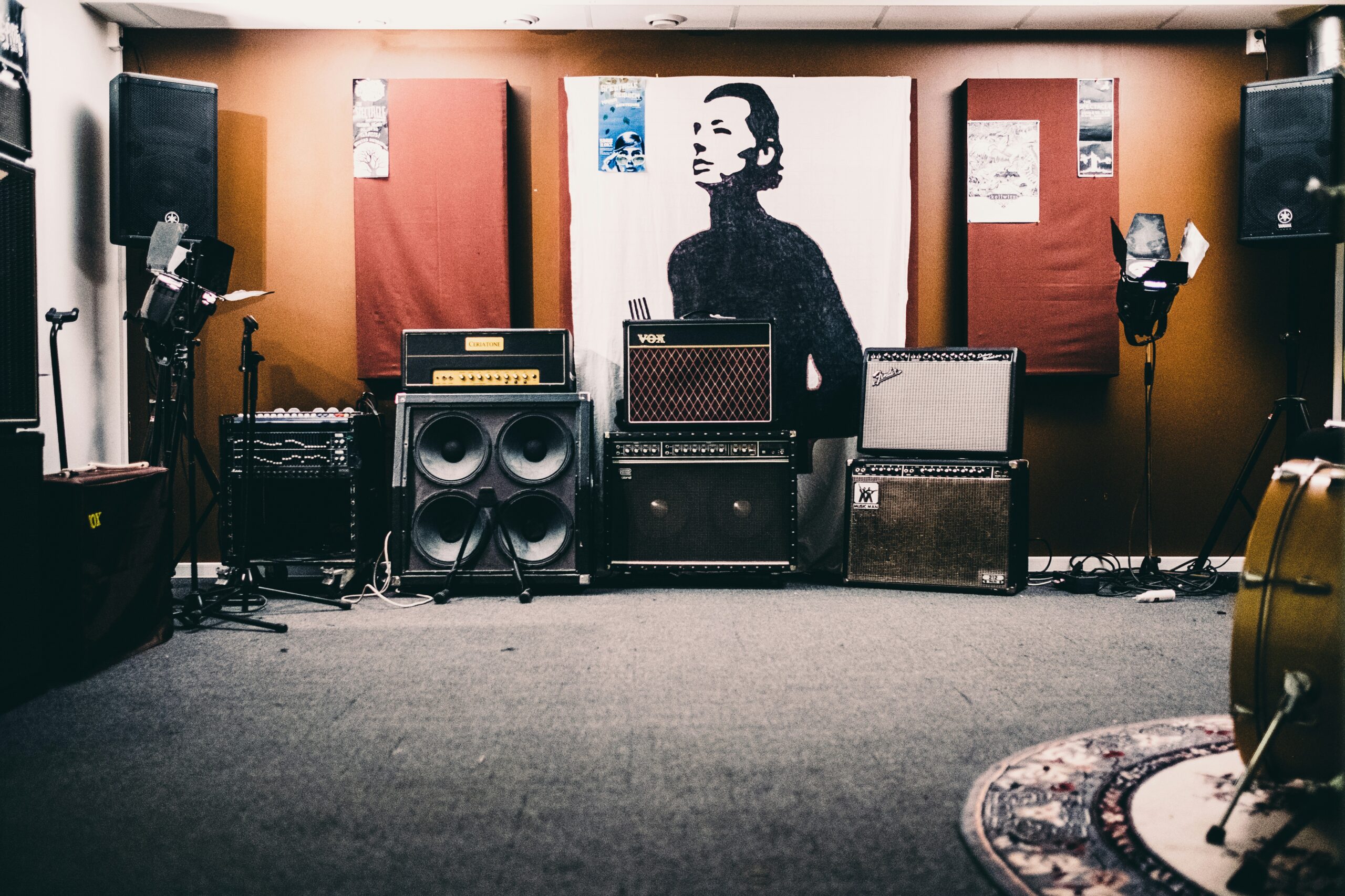 School music practice room with amplifiers, monitors and acoustic wall treatment