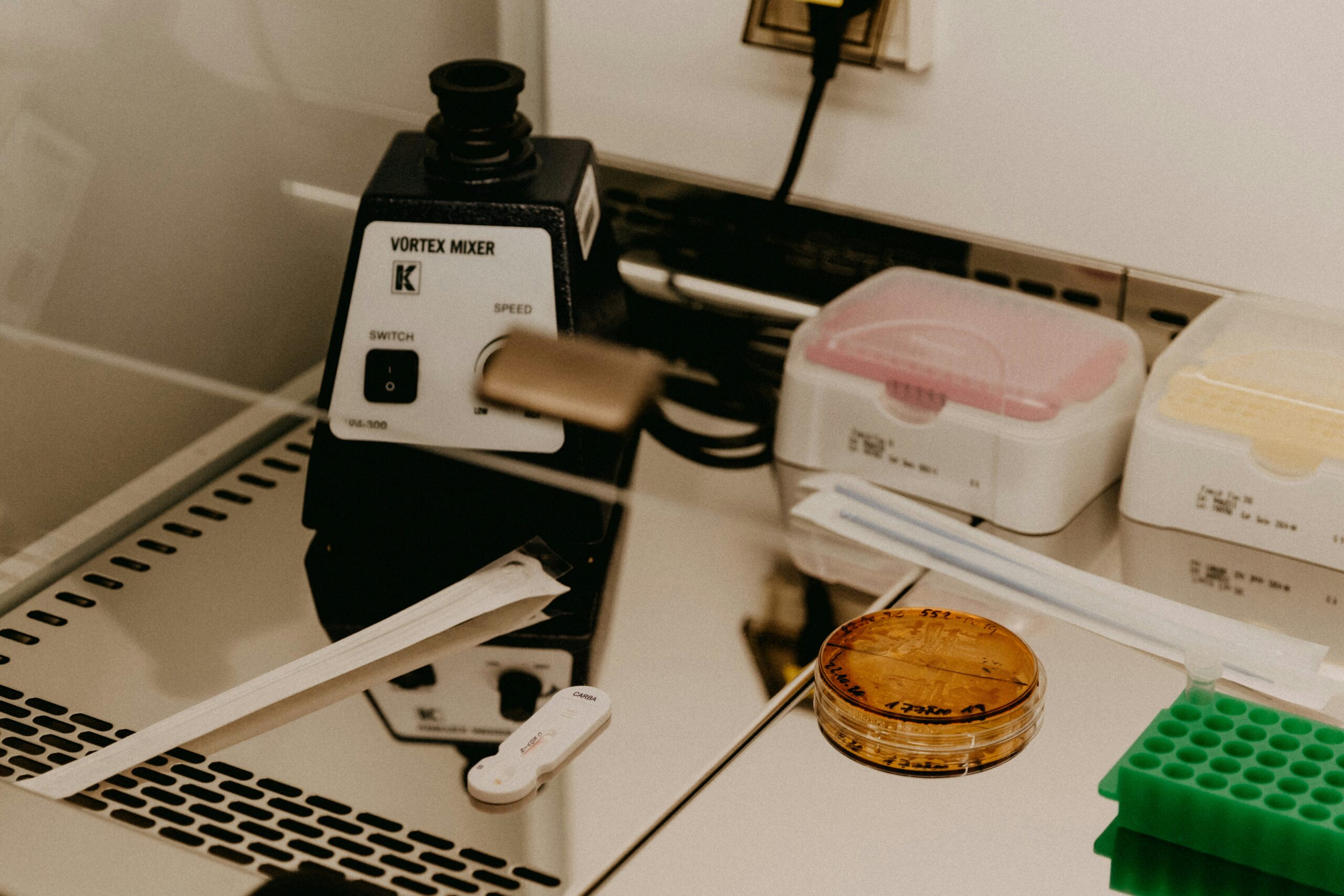 Microscope and sample preparation equipment on a school science laboratory bench