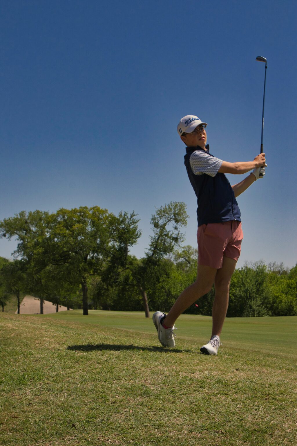 Student athlete following through on a golf drive