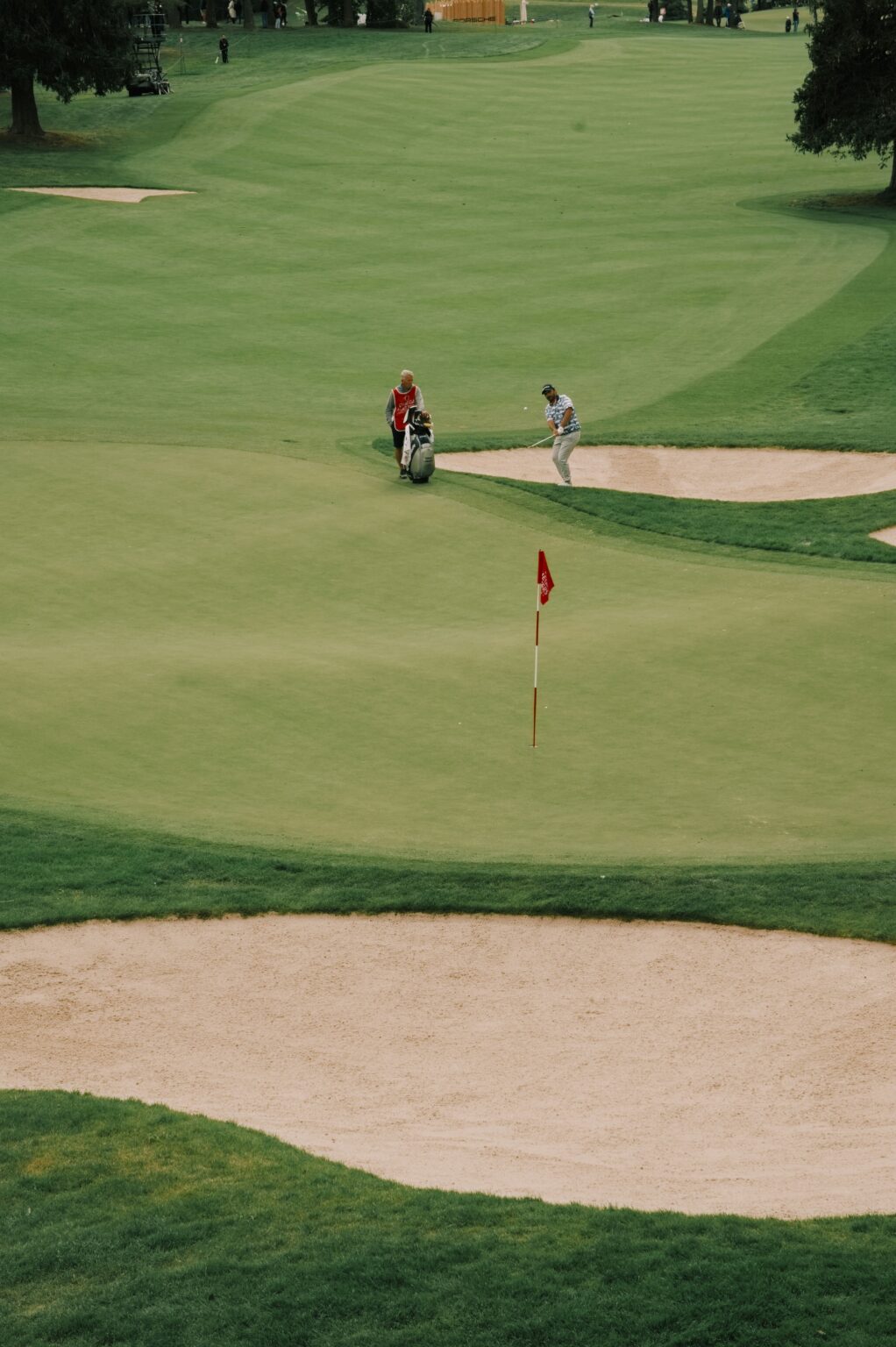 Golf course green with flag and sand bunkers